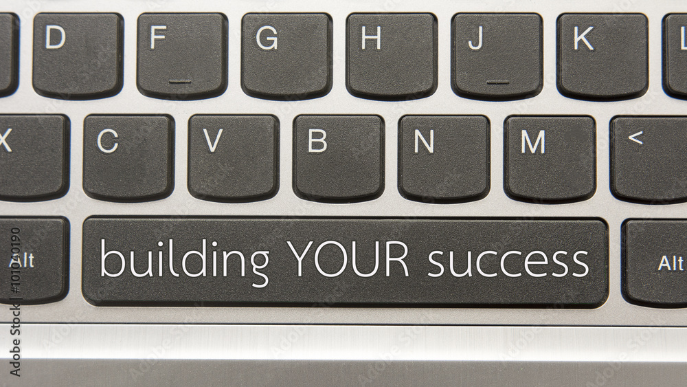 Building your success written on large button of keyboard Building your success written on large button of keyboard