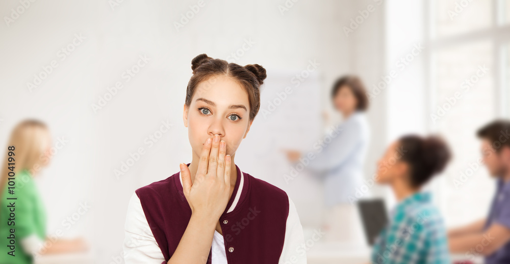 confused student girl covering her mouth by hand confused student girl covering her mouth by hand
