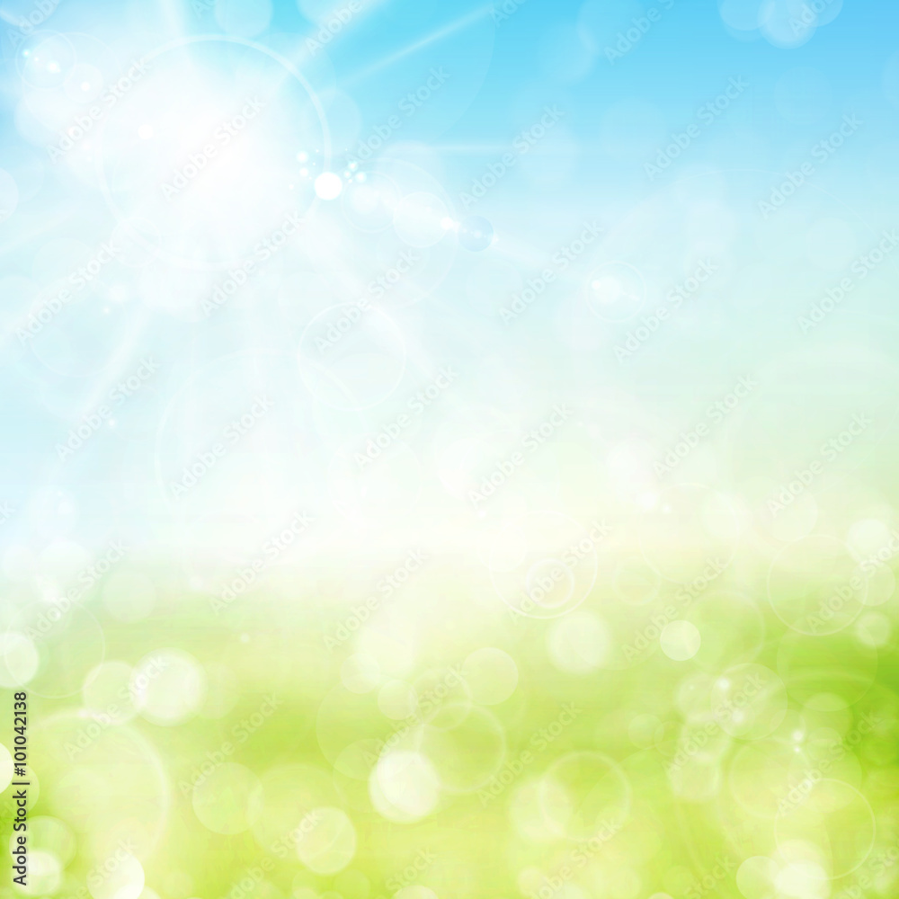 Green spring bokeh background with sunny sky and blurry light do
