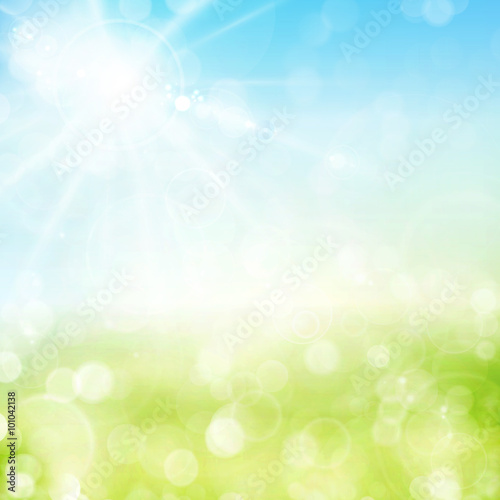 Green spring bokeh background with sunny sky and blurry light do