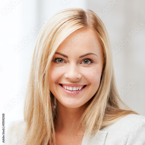 happy smiling young woman face or portrait