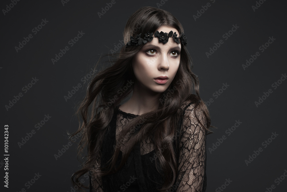 Studio portrait of a beautiful girl in Gothic style Studio portrait of a beautiful girl in Gothic style