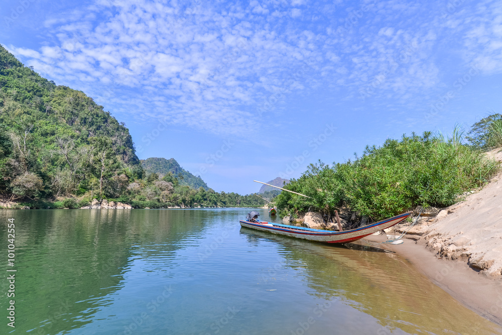 Thai style long-tailed boat with mountain landscape. Thai style long-tailed boat with mountain landscape.