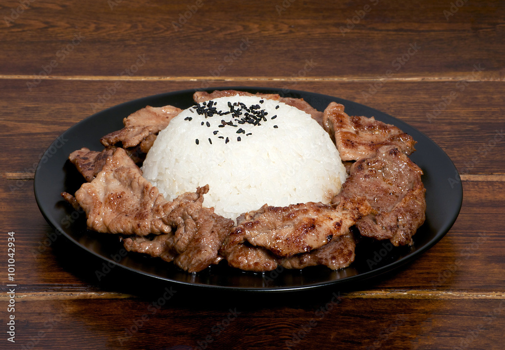 Portion of rice with meat on the plate Portion of rice with meat on the plate