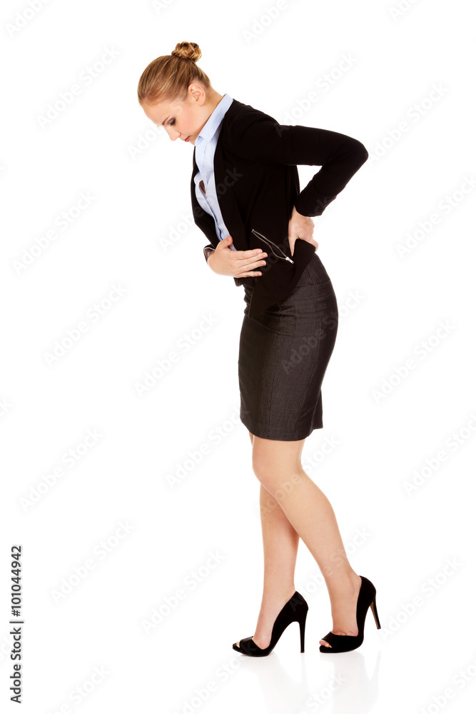 Business woman with back problems and stomach ache