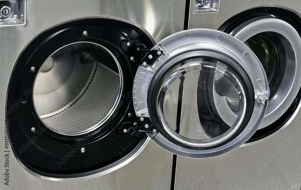 Industrial washing machines in a public laundromat Industrial washing machines in a public laundromat