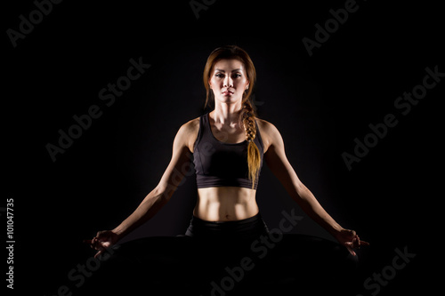 Young woman practicing yoga.