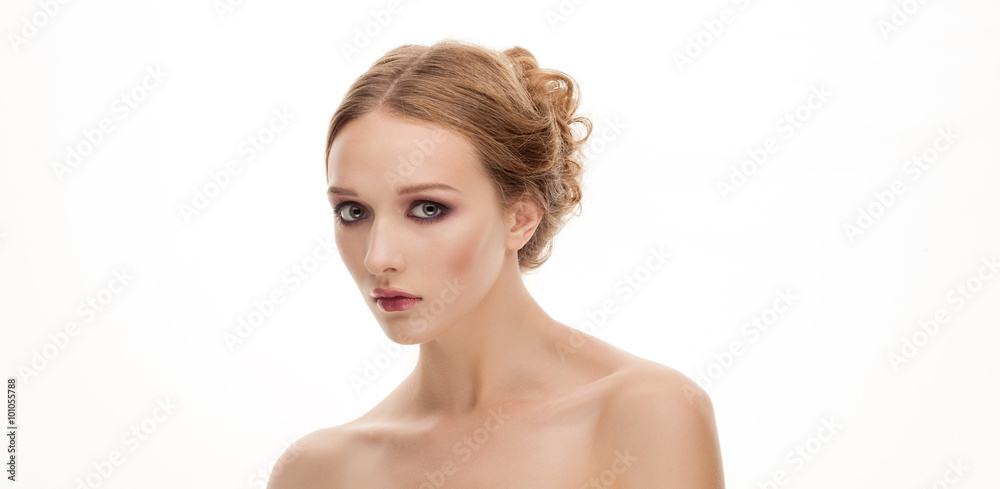 Closeup beauty portrait of young adorable blonde woman with trendy makeup and bare shoulders isolated on white background