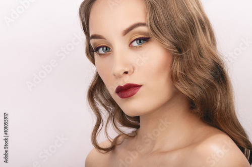 Closeup studio portrait of young fashionable woman with trendy gorgeous makeup