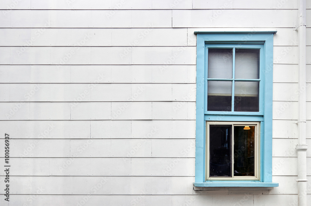 Blue window on white wall