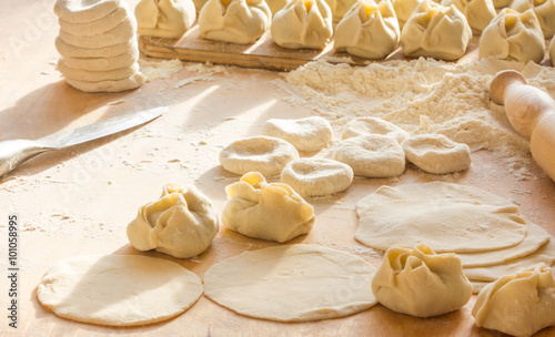 Preparation of Manti - Uzbek dumplings. Central Asian traditional food.  photo