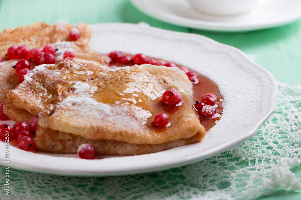 Fresh homemade crepes on plate with fresh berries Fresh homemade crepes on plate with fresh berries