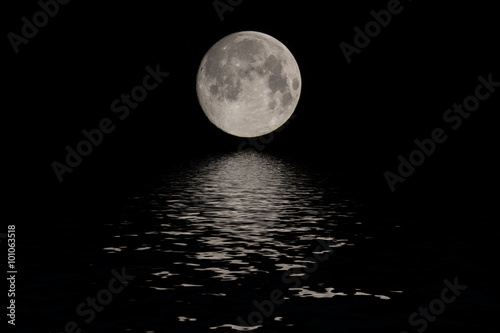 Full moon over dark black sky at night © Ivan Kurmyshov