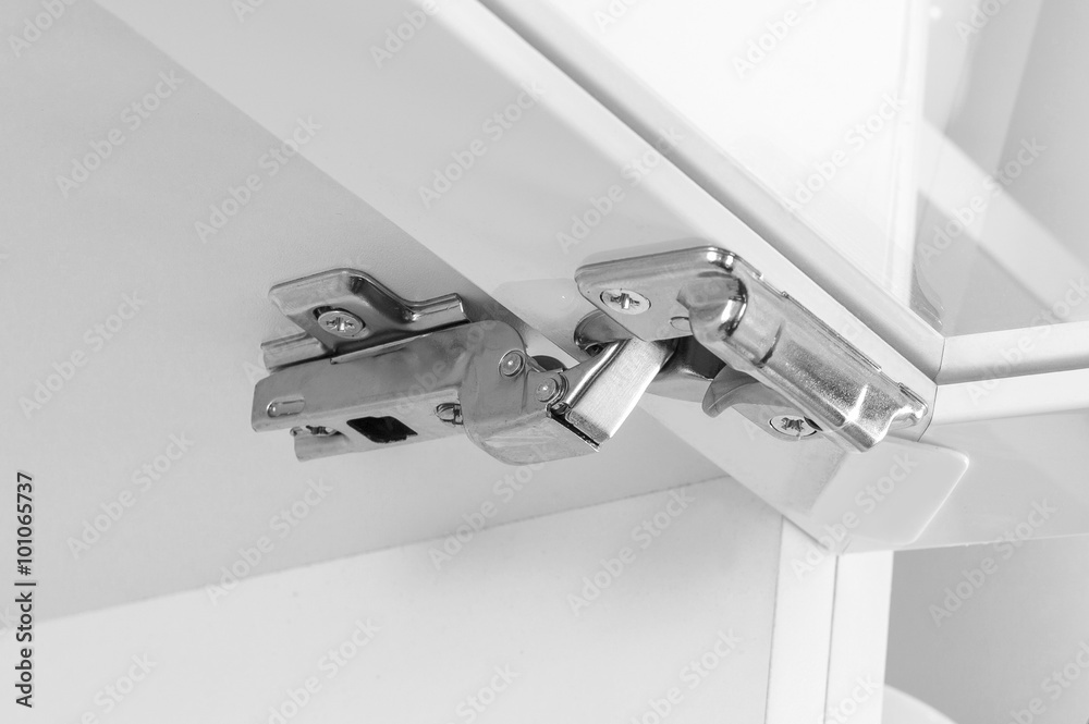 Closeup of furniture cabinet modern clip hinge with amortization