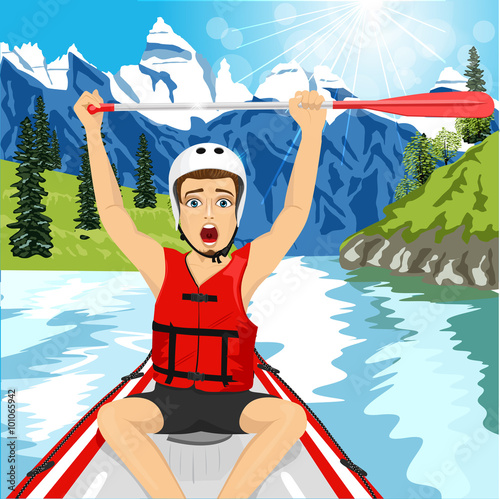 Young man in a raft boat crossing finish raising his paddle