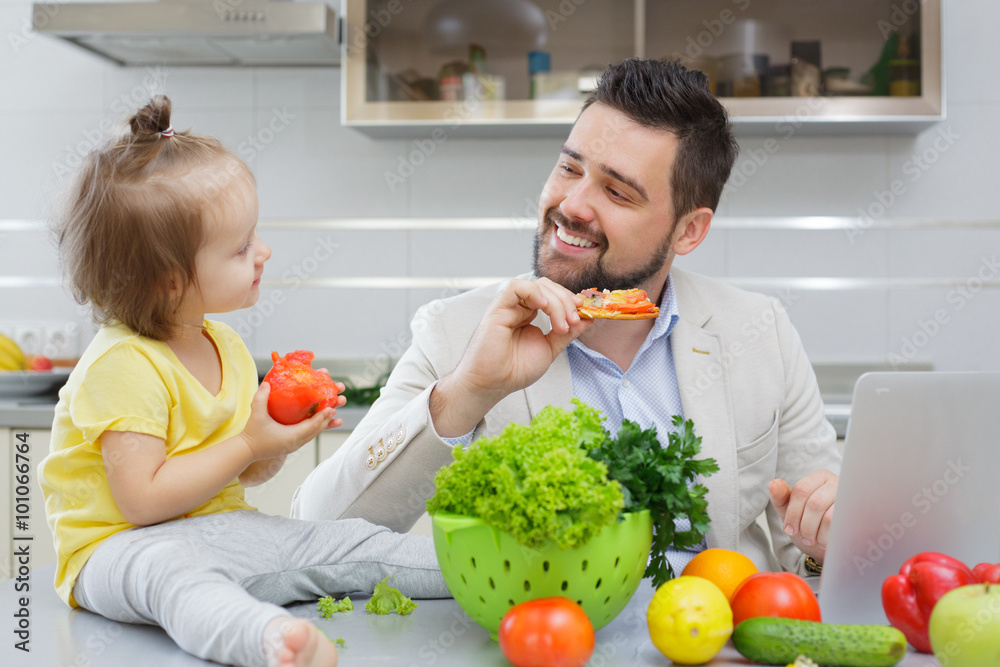 happy father and his child have fun during lunch happy father and his child have fun during lunch