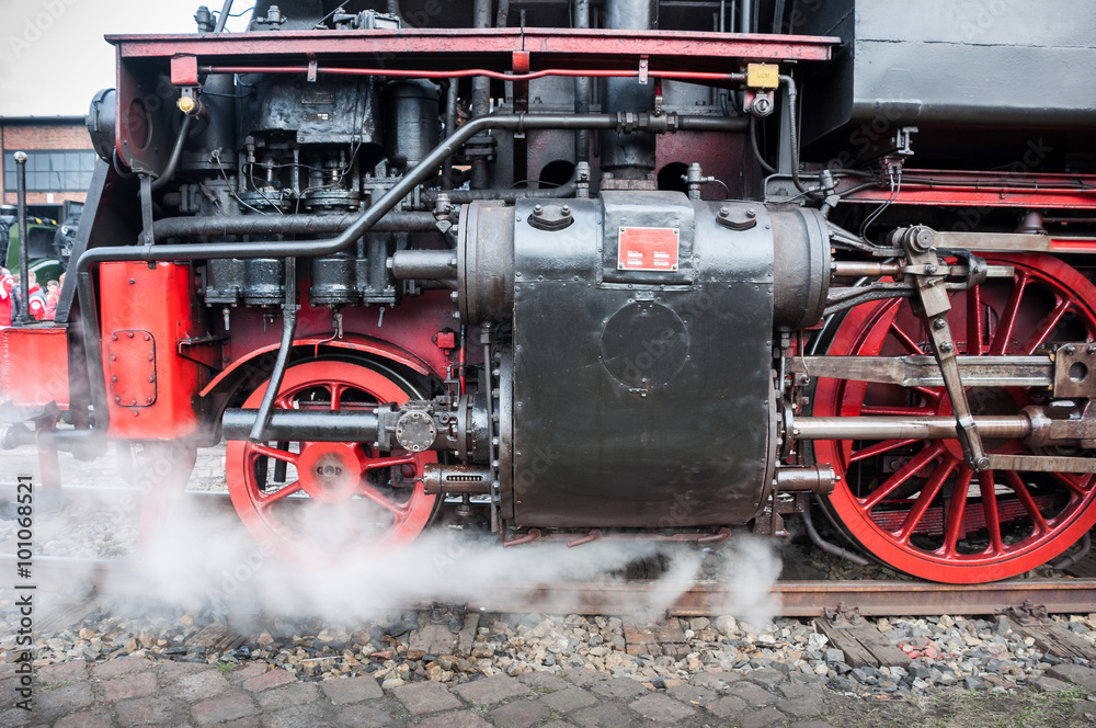 Old german steam locomotive. Detail and close up of huge wheels.