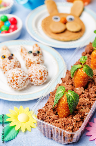 Easter background with sweets and juice for kids