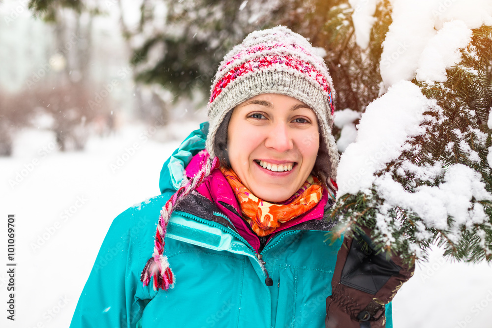 Young happy woman enjoy snow in winter city park outdoor Young happy woman enjoy snow in winter city park outdoor