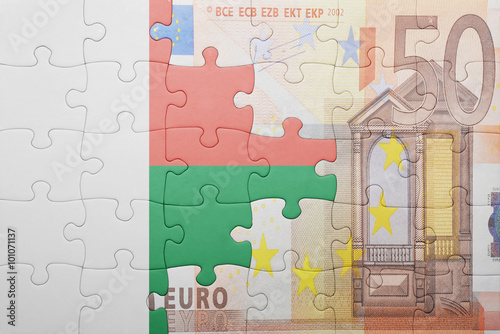 puzzle with the national flag of madagascar and euro banknote