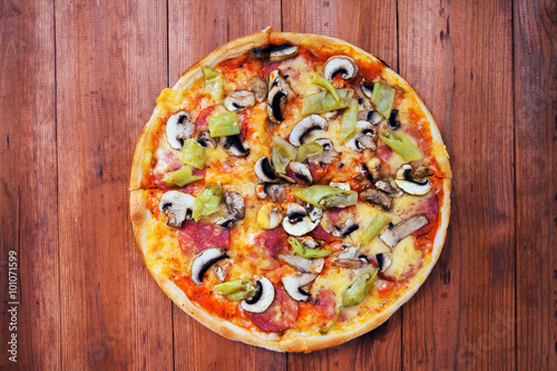 pizza isolated on a wooden background