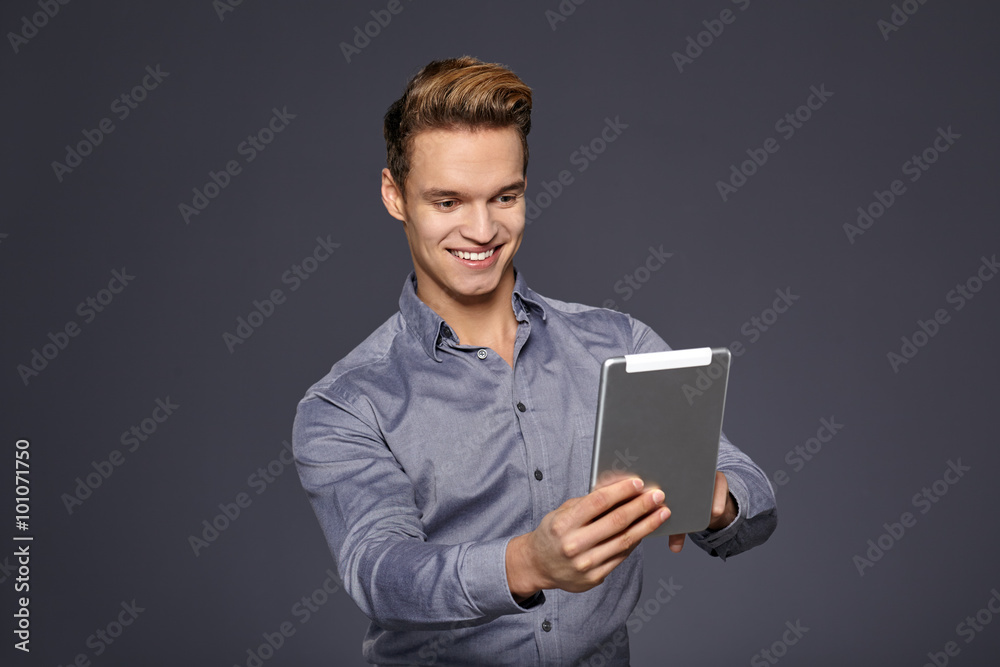 Casual Businessman Looking at a tablet,