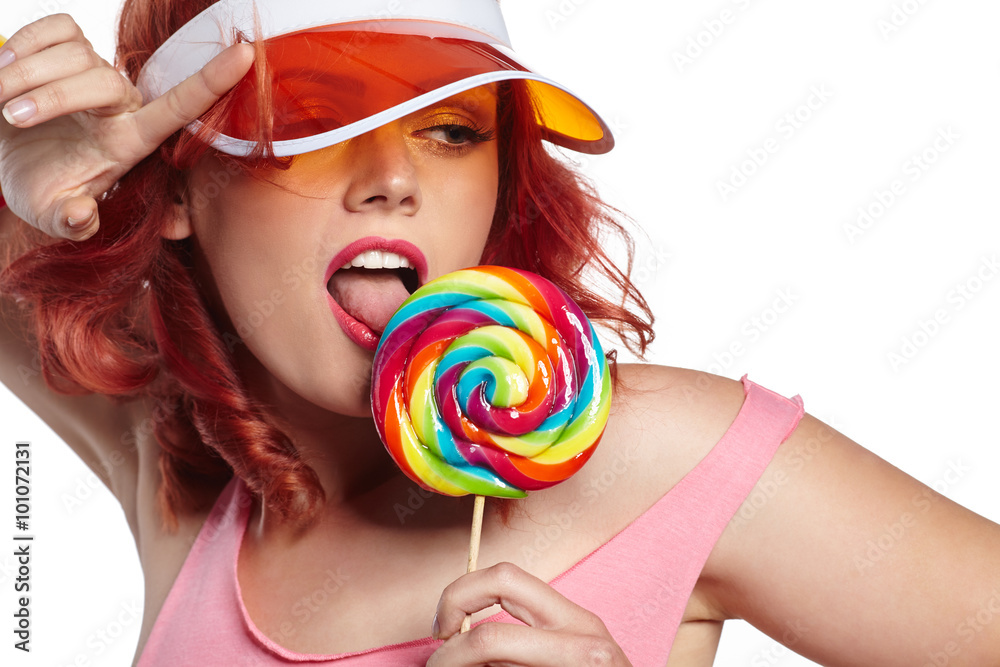 Bright makeup. Beauty Girl Portrait holding Colorful lollipop.