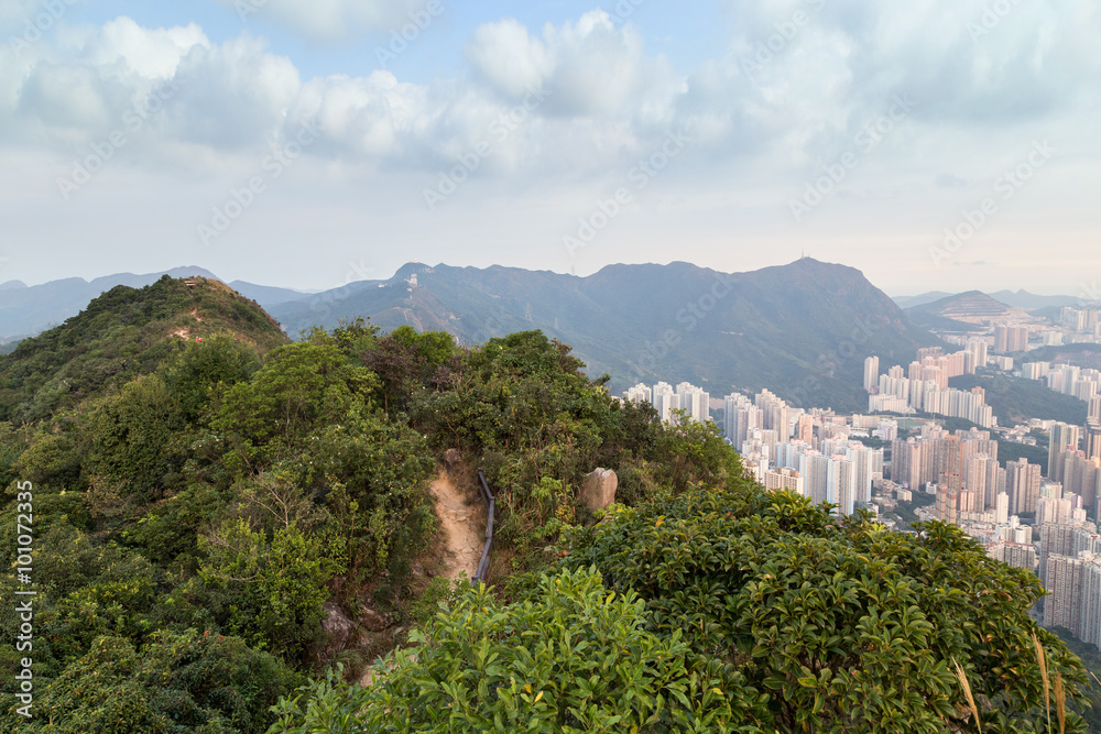 Fototapeta premium View of Lion Rock Country Park and New Kowloon in Hong Kong from above from the Lion Rock in Hong Kong, China.