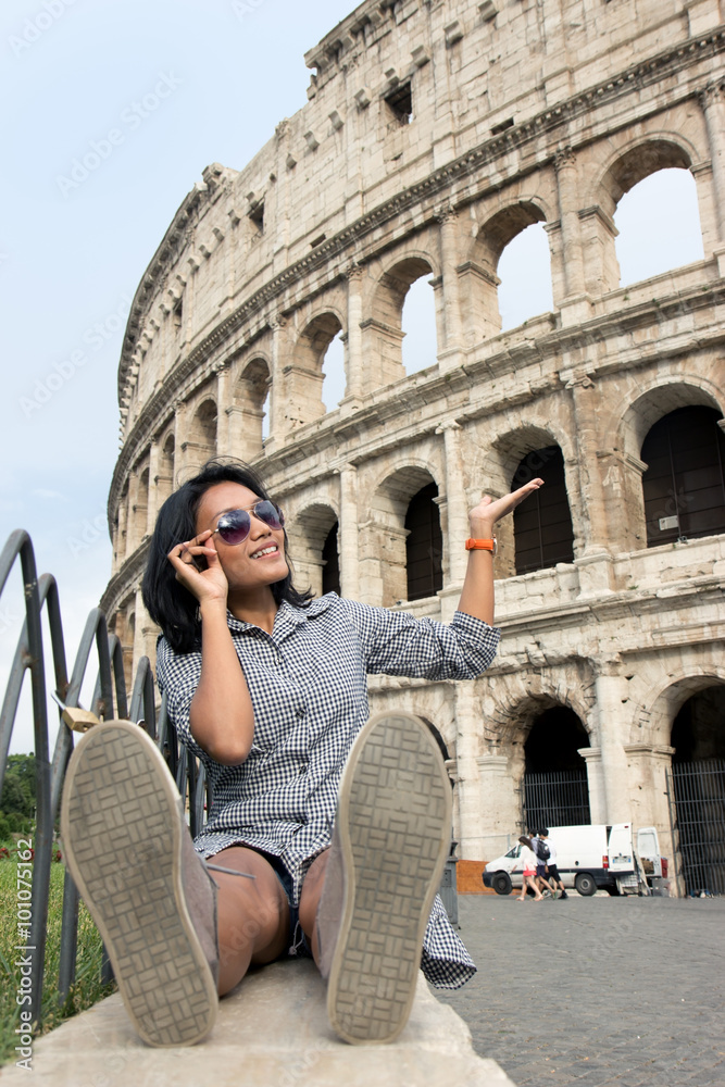 woman with sunglasses showing at Colosseum