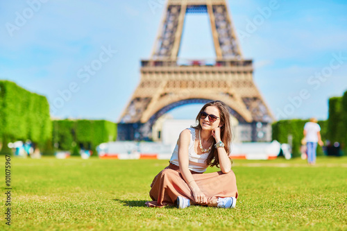 Young tourist near the Eiffel tower © Ekaterina Pokrovsky