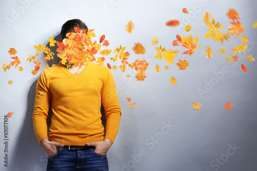 Young man and falling autum...