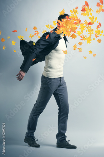 Young man and falling autum...