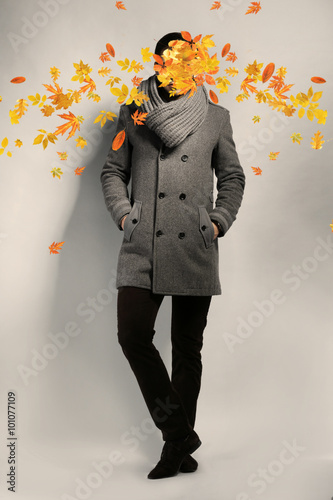 Young man and falling autum...