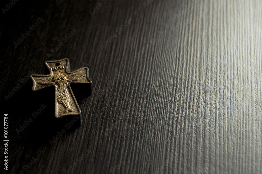 cross on wooden background