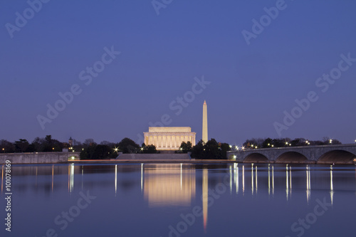 Abraham Lincoln Monument, Arlington Memorial Bridge and Washington Monument with reflection on Potomac River at sunset, Washington, DC, United States