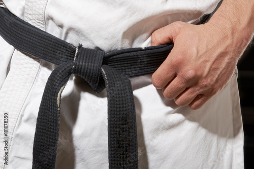 Karate stance hand and black belt