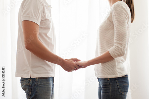 Young couple holding hands. 