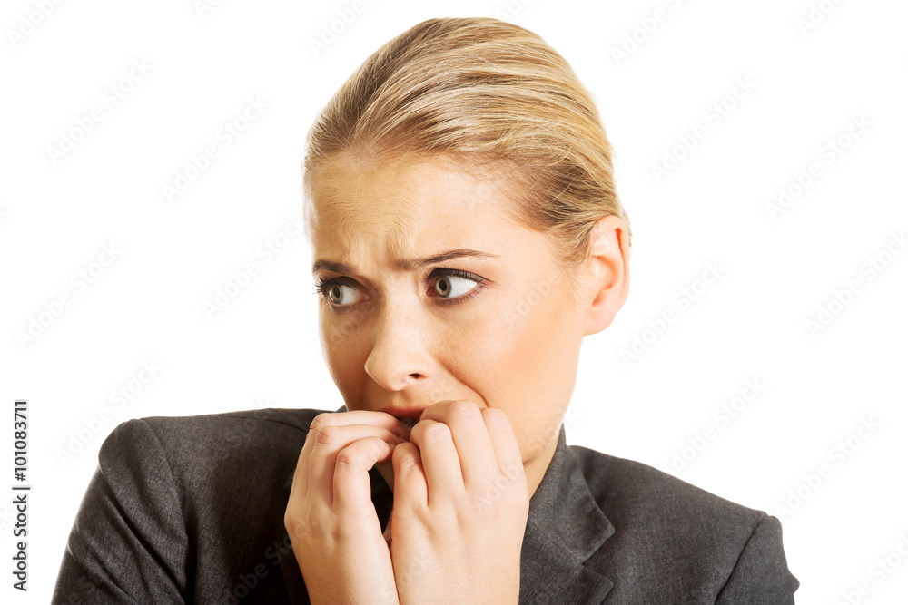 Stressed young woman biting her nails Stressed young woman biting her nails