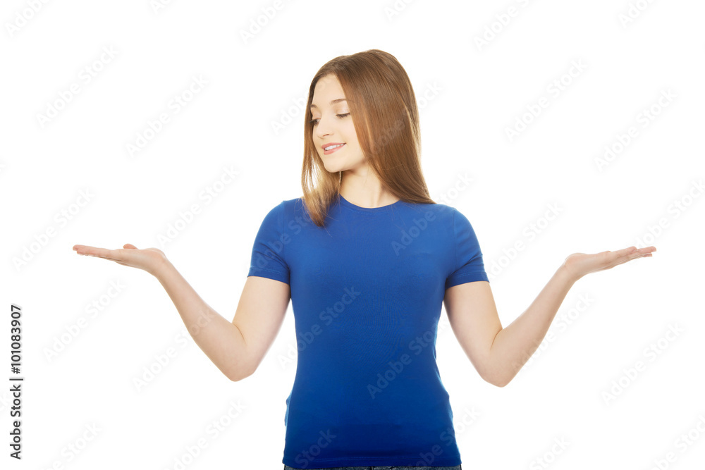 Smiling woman showing something on palms. Smiling woman showing something on palms.