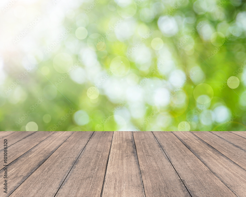 Wooden plank and bokeh abstract green background - used for montage display your products Wooden plank and bokeh abstract green background - used for montage display your products