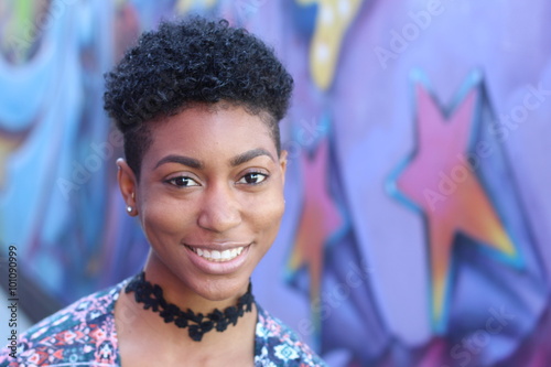 Stock image of an attractive young black woman with short haircut style