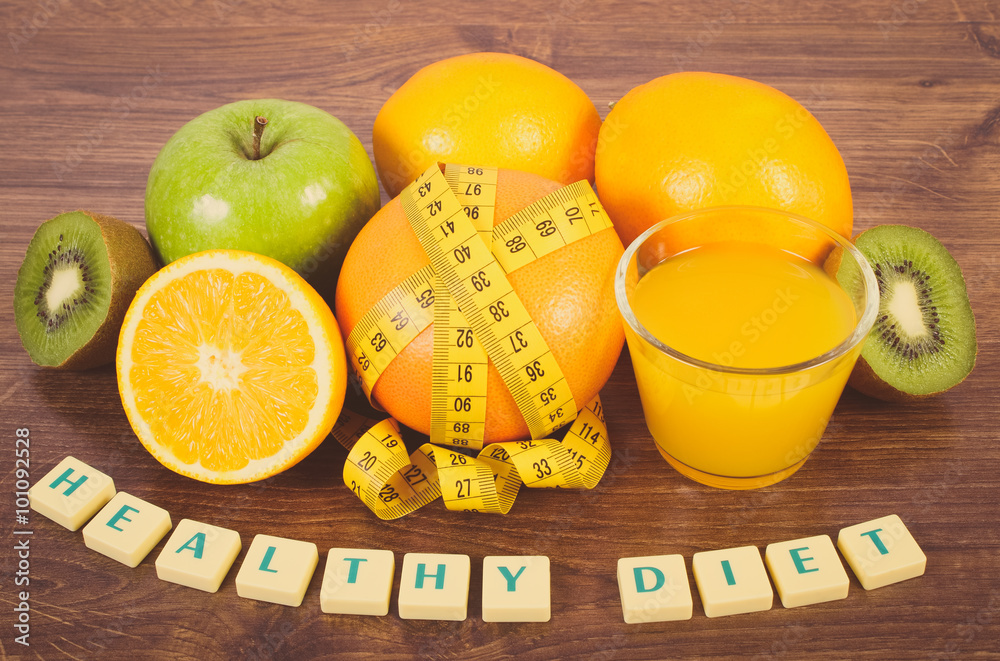 Fresh fruits, juice and tape measure, healthy lifestyles and nutrition Fresh fruits, juice and tape measure, healthy lifestyles and nutrition