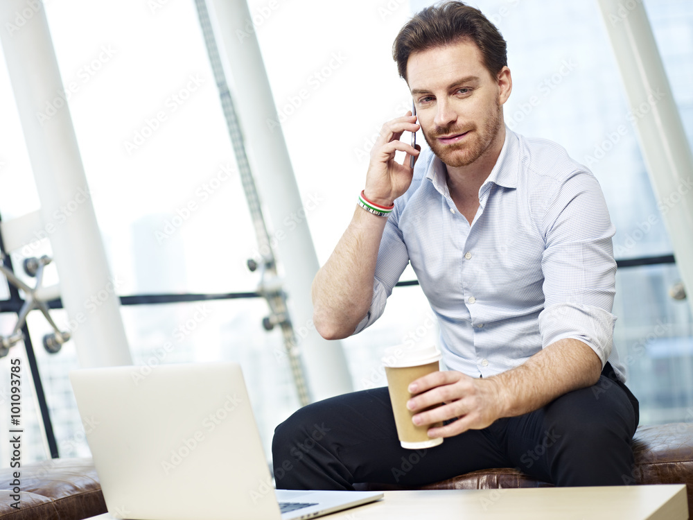 businessperson talking on cellphone businessperson talking on cellphone