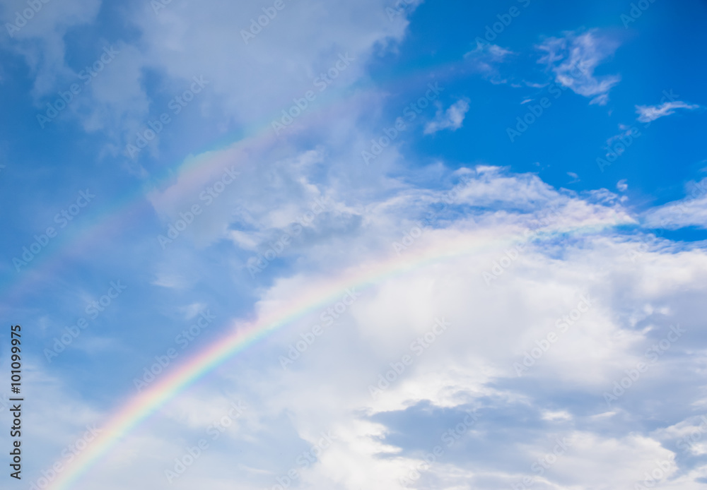 Blue sky with rainbow