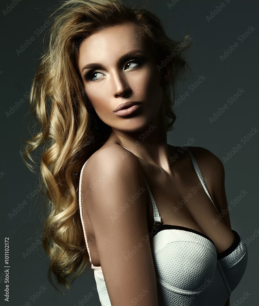 Naklejka premium sensual glamour portrait of beautiful blond woman model lady with fresh makeup and healthy curly hair