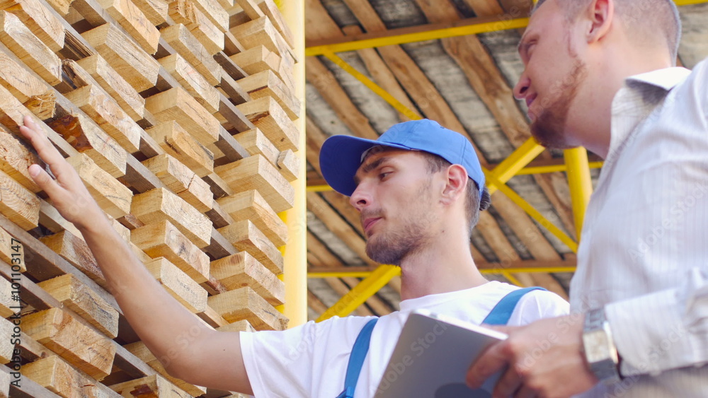 Young warehouse worker timber to communicate with customers Young warehouse worker timber to communicate with customers