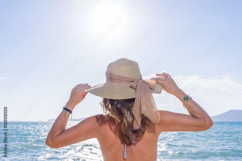 woman enjoying beach relaxing joyful in summer