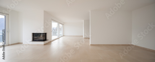 interior of new apartment, empty living room, tiled floor