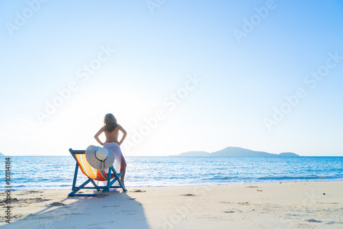 Woman enjoying the sun at the beach