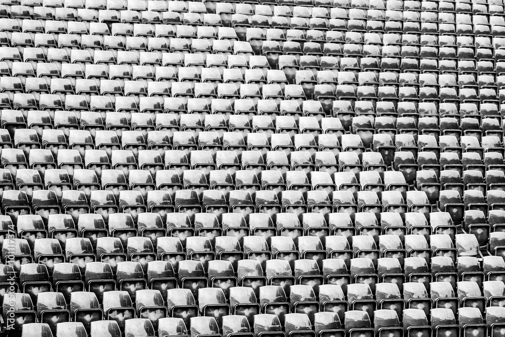 Fototapeta premium Row of seats black and white image at stadium background and texture.